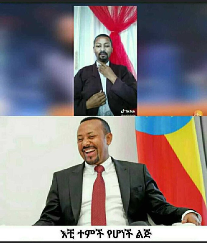 a man in a suit and tie is smiling